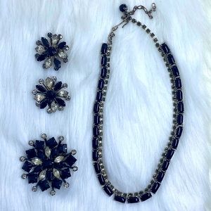 Vintage rhinestone jewelry. Necklace, pin on broach, and clip on earrings.